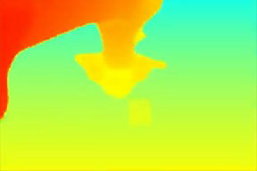Predicted future depth map: the arm has moved over the red block.
